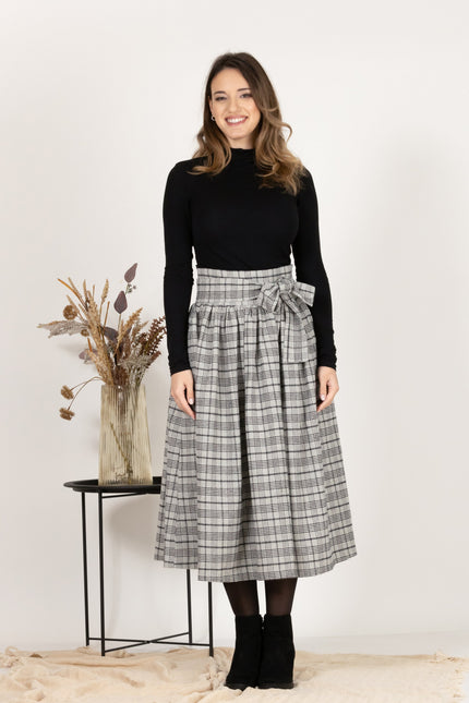 Front view of Wool Midi Plaid Skirt with High Waisted Bow and Pockets
showcasing classic design