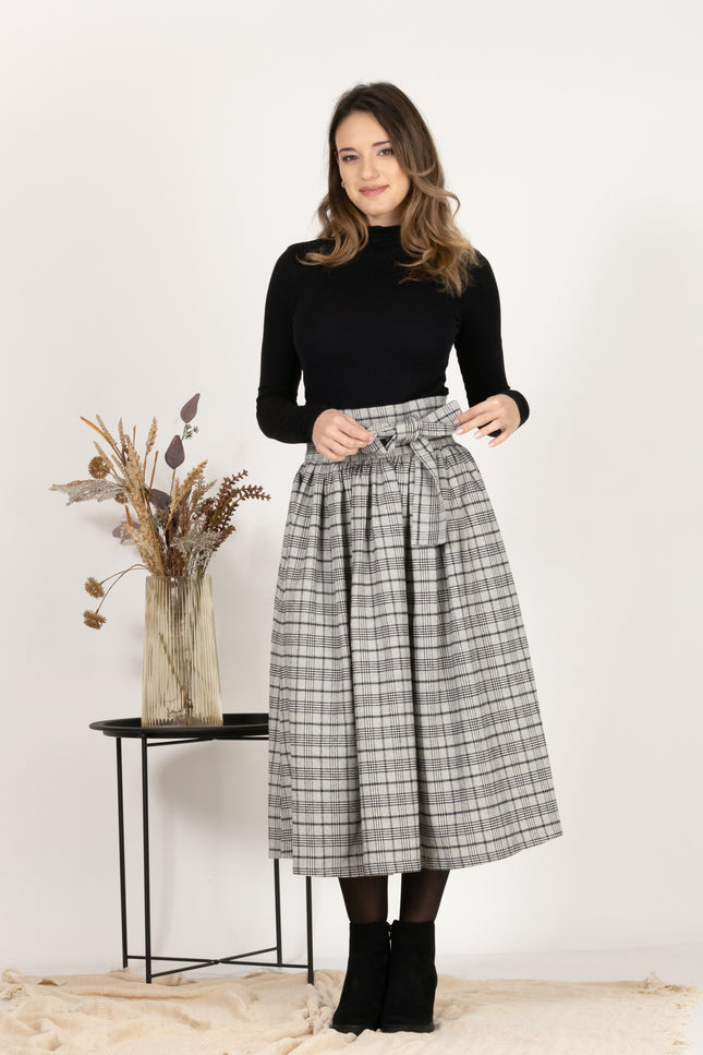 Front view of Wool Midi Plaid Skirt with High Waisted Bow and Pockets
highlighting the bow detail at the waist