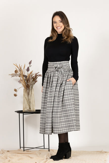 Front profile of Wool Midi Plaid Skirt with High Waisted Bow and Pockets
highlighting the loose flare style