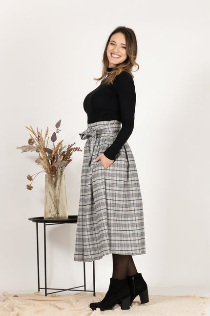 Side view of Wool Midi Plaid Skirt with High Waisted Bow and Pockets
emphasizing the side pockets