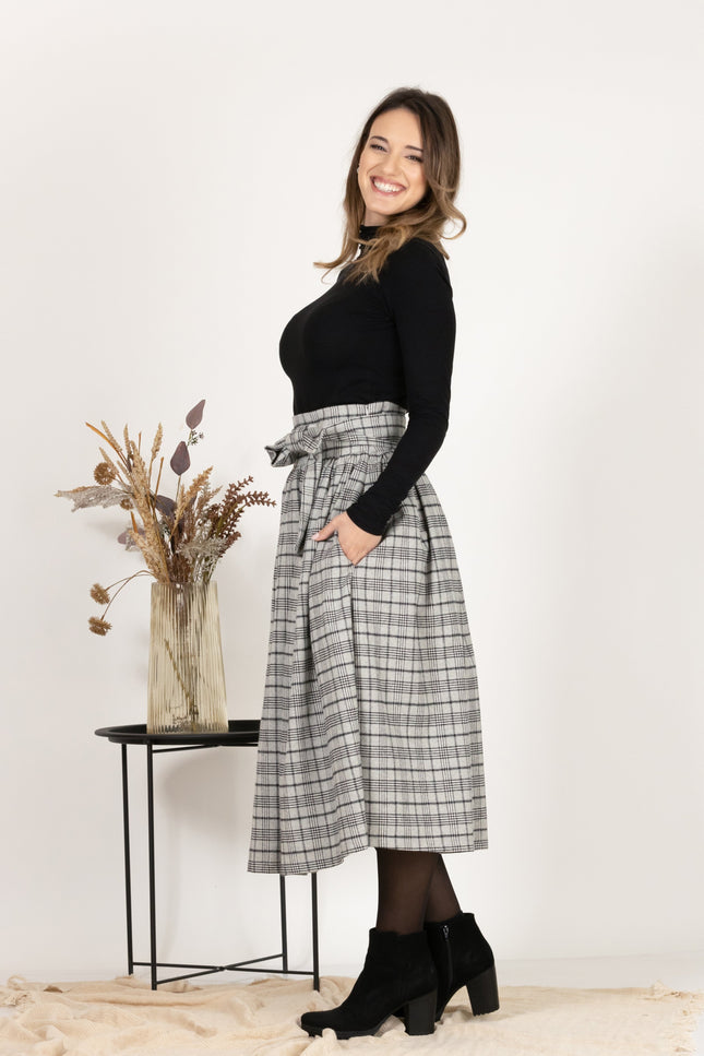 Side view of Wool Midi Plaid Skirt with High Waisted Bow and Pockets
emphasizing the side pockets