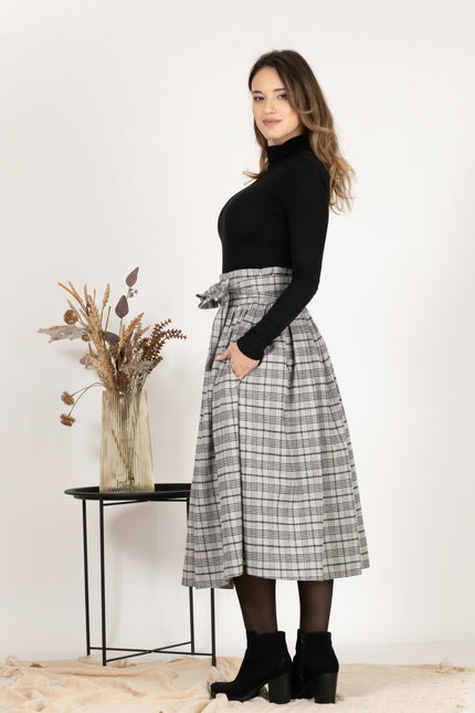 Side profile of Wool Midi Plaid Skirt with High Waisted Bow and Pockets, highlighting the flow
