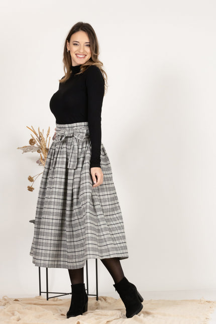 Side view of Wool Midi Plaid Skirt with High Waisted Bow and Pockets
highlighting high waist
