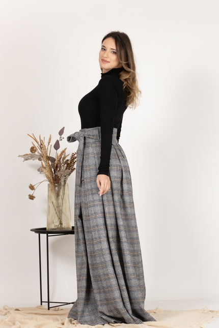 Side view of Plaid Wool Pleated Skirt with Ultra High Waist and Bow showing the maxi length