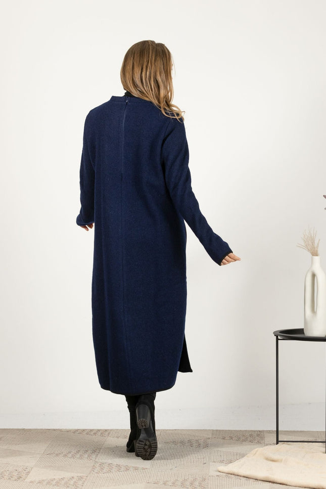 Full-length back view of the Dark Blue Wool Winter Sweater Dress, highlighting the mid-calf length and the clean, minimalist lines.