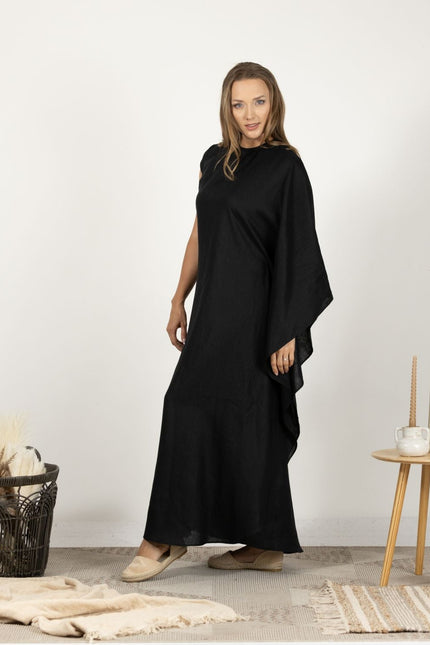 Side profile of model in the Extravagant Linen Dress with Batwing sleeves, illustrating the unique sleeve design and high-quality linen fabric.