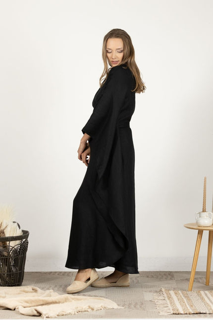 Profile image of the Extravagant Linen Dress with Batwing sleeves on model, showing the sophisticated cut and fluid movement of the dress.