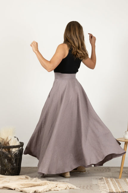Back view of model in the Linen Flutter Skirt, showing the skirt's full length and flowing design.