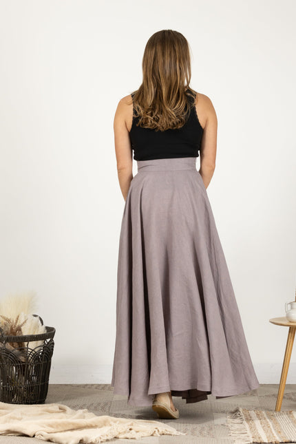 Rear perspective of the Linen Flutter Skirt on model, highlighting the skirt's graceful and timeless design.