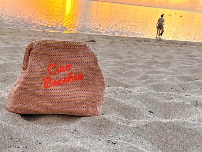 Neon orange Ciao Beaches clutch pouch by Lilly Loves with zipper closure and compact design, perfect for carrying small essentials.