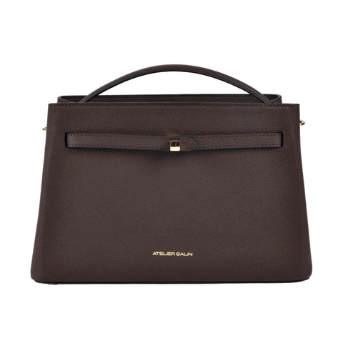 Brown handbag with a visible brand logo on a white background