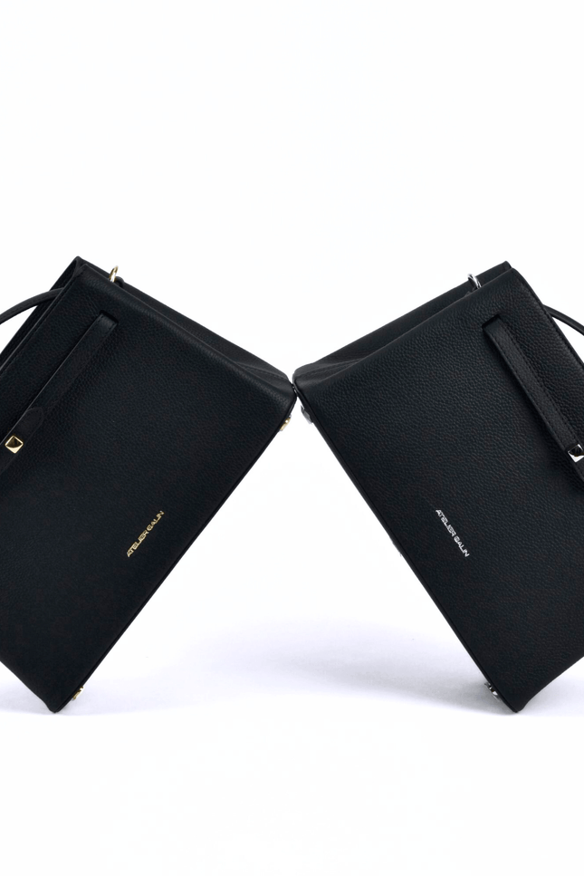 Black atelier galin cube lock handbag with silver hardware and brand logo gold bag 