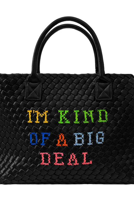Lilly Loves I'm Kind Of A Big Deal handbag in black with bold white lettering, stylish accessory with top handle and gold accents.