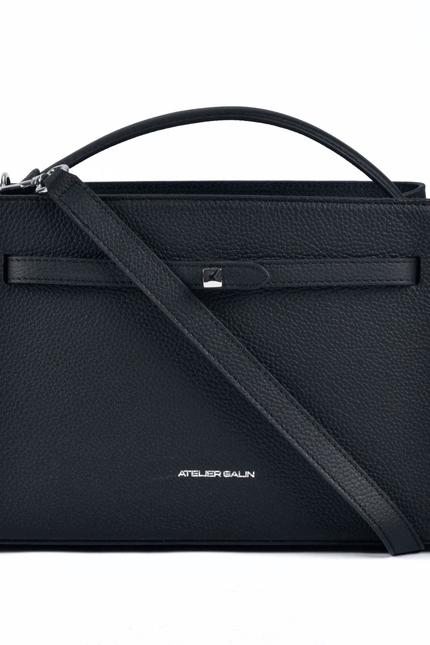Black atelier galin cube lock handbag with silver hardware and brand logo detachable strap