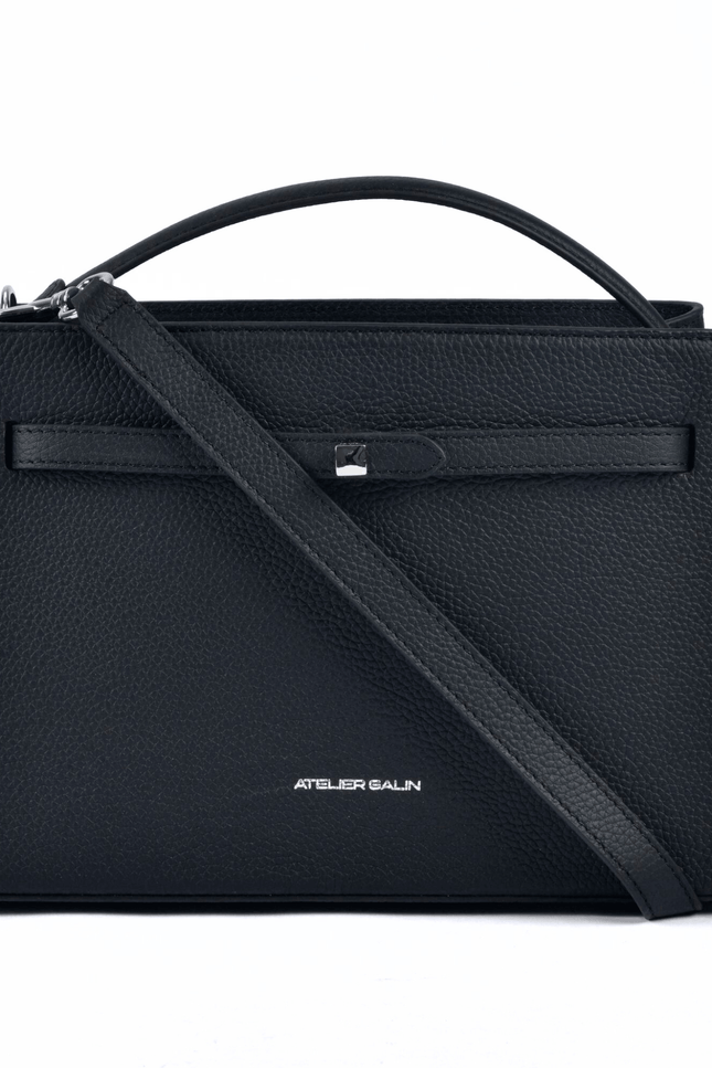 Black atelier galin cube lock handbag with silver hardware and brand logo detachable strap