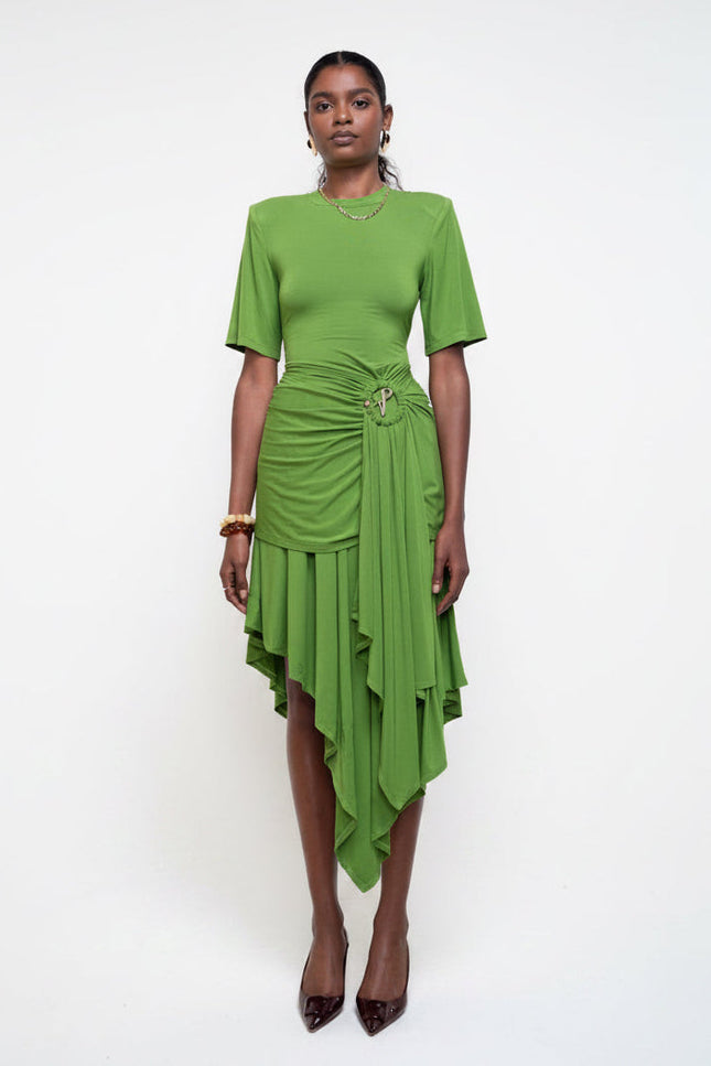 Woman wearing a green dress against a white background