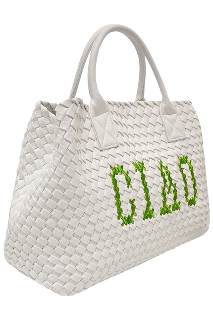 Green Lilly Loves Ciao vegan handbag with white accents, showcasing a stylish design and durable handles for everyday use.
