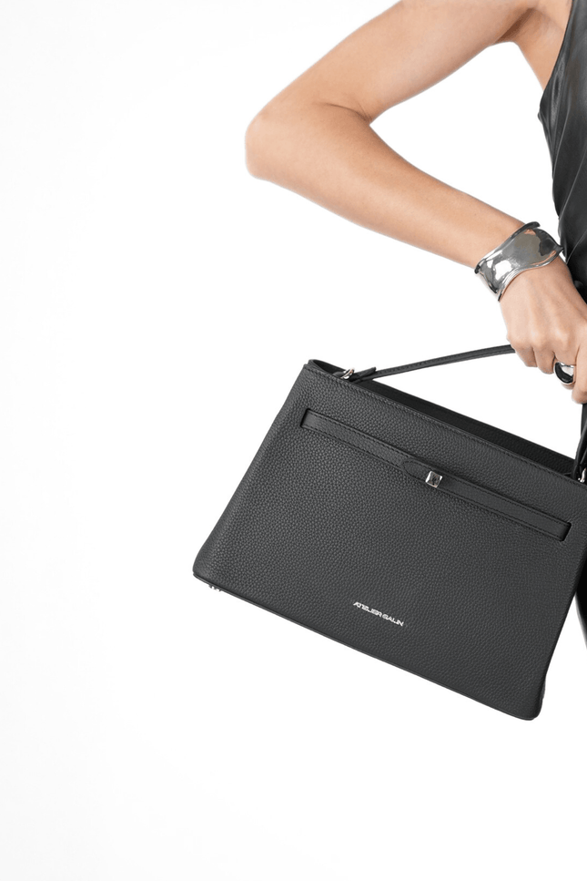 Black atelier galin cube lock handbag with silver hardware and brand logo style 
