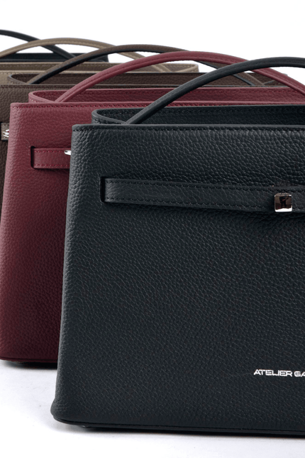 Four leather handbags in different colors with 'Atelier Galin' branding on a white background.