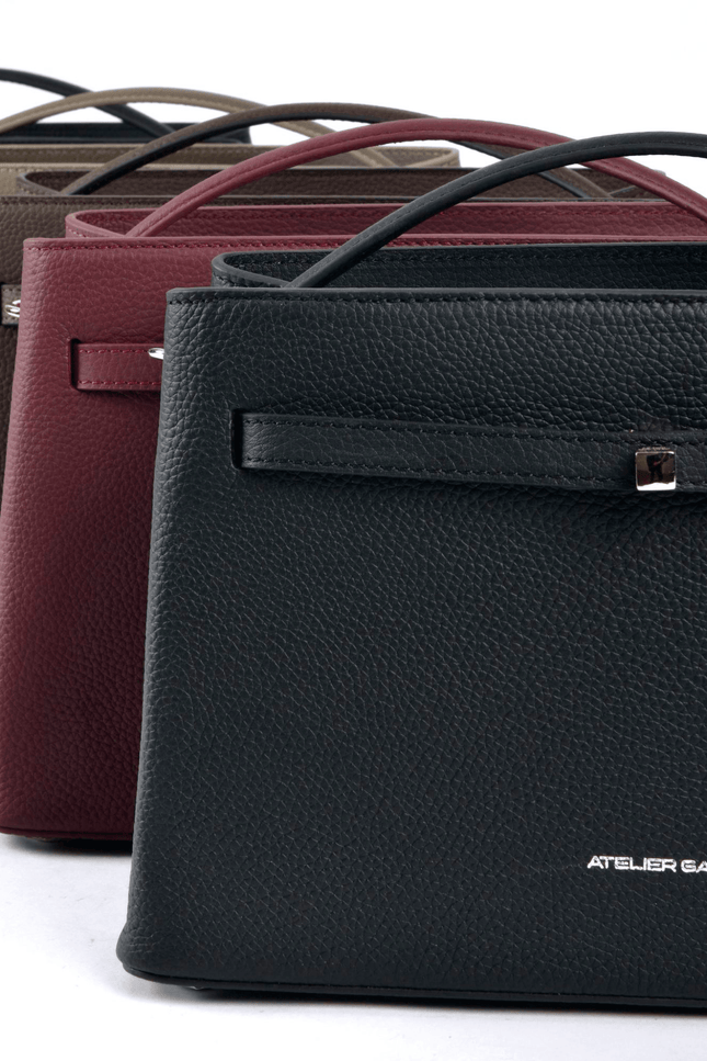 Four leather handbags in different colors with 'Atelier Galin' branding on a white background.