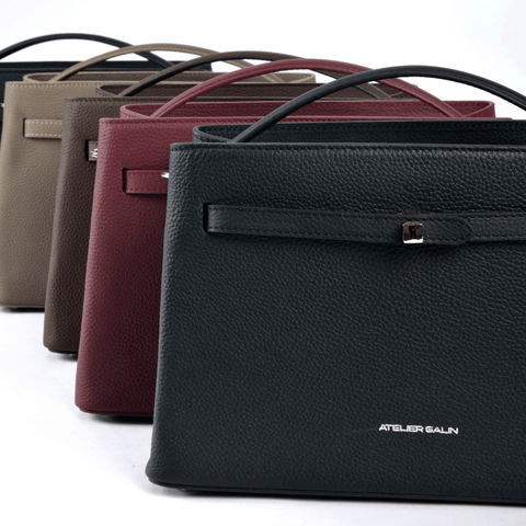 Four leather handbags in different colors with 'Atelier Galin' branding on a white background.