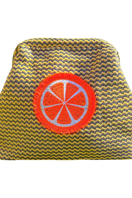 Orange fluffy clutch pouch by Lilly Loves, featuring soft plush material and compact design for stylish carrying.