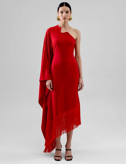 Woman wearing a red one-shoulder dress with fringe on a white background