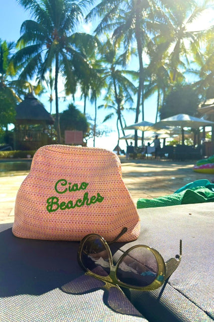 Lilly Loves Ciao Beaches pink clutch pouch with easy closure, stylish and compact accessory for essentials.