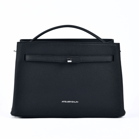 Black atelier galin cube lock handbag with silver hardware and brand logo on a white background