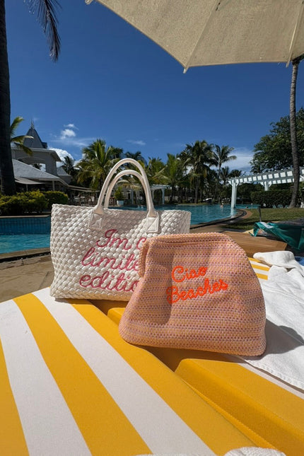 Neon orange Ciao Beaches clutch pouch by Lilly Loves with a vibrant, compact design and zipper closure.