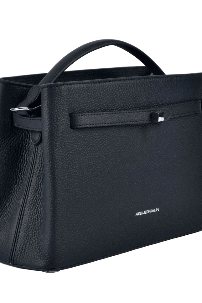 Black atelier galin cube lock handbag with silver hardware and brand logo on a white background