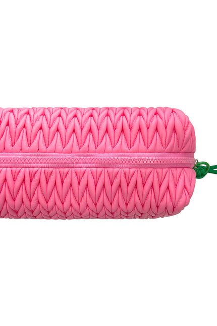 Pink Lillyloves squishy makeup bag with soft fabric exterior, designed for storing cosmetics and toiletries.