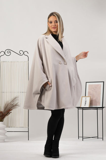 One-size off-white cape with relaxed drop shoulders