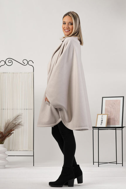 One-size off-white cape with relaxed drop shoulders
