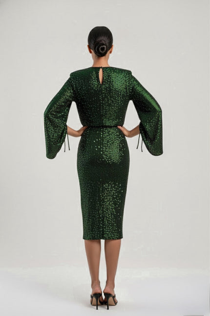 Green sequin dress with long sleeves on a white background