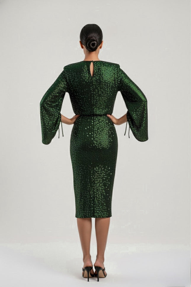 Green sequin dress with long sleeves on a white background