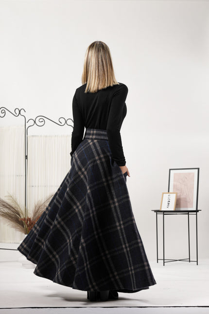 Back view of the Plaid High Waisted Wool Maxi Skirt, emphasizing the clean lines and the full A-line, flared silhouette for a classic look.