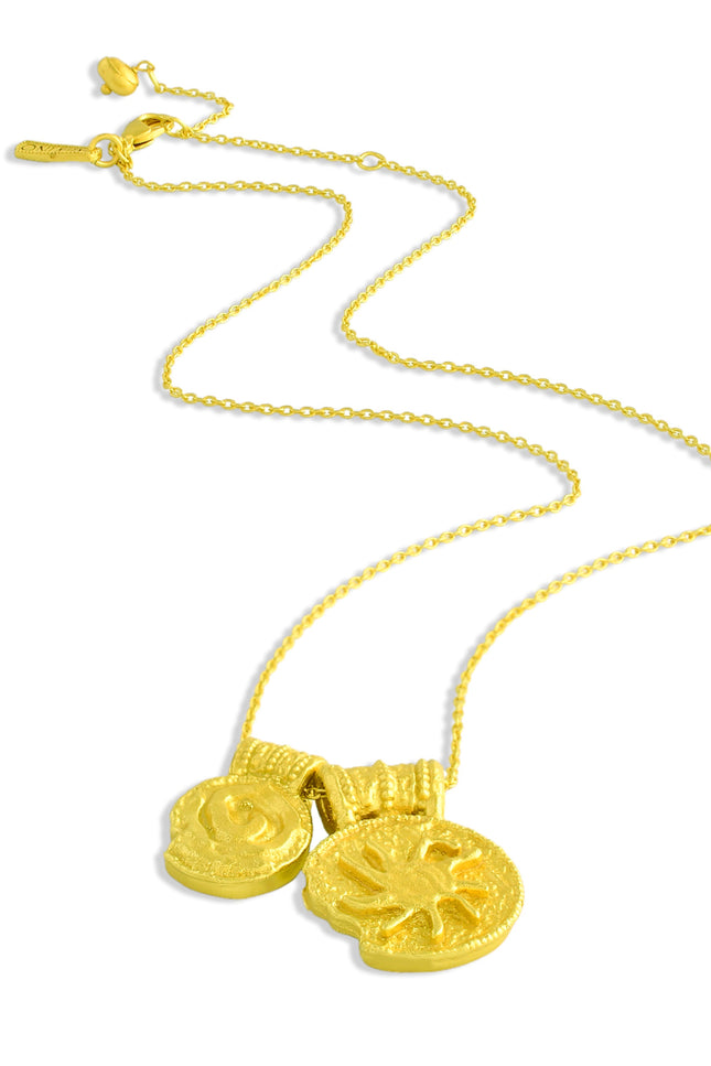 Gold plated necklace with two round ancient charms on a white background