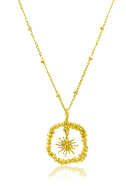 White board shot of Gold plated Granulated Sunburst Necklace by arvino