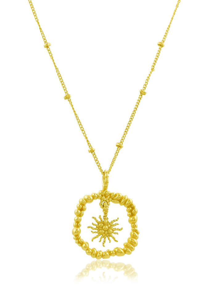 White board shot of Gold plated Granulated Sunburst Necklace by arvino