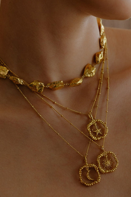 Model Stacking some Gold plated Necklace By arvion From its demi fine jewellery collection