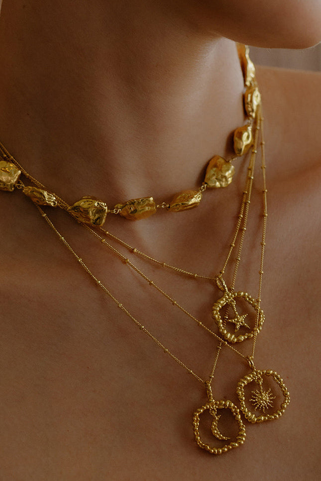 Model Stacking some Gold plated Necklace By arvion From its demi fine jewellery collection