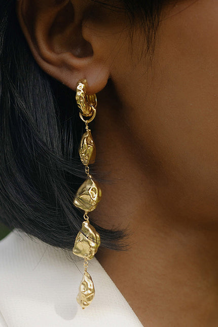 Close Up model shot of Asymmetrical Nugget Dangler Earrings By Arvino
