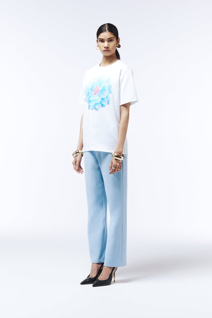 Soft blue cotton tee featuring oversized pastel dahlia graphic
