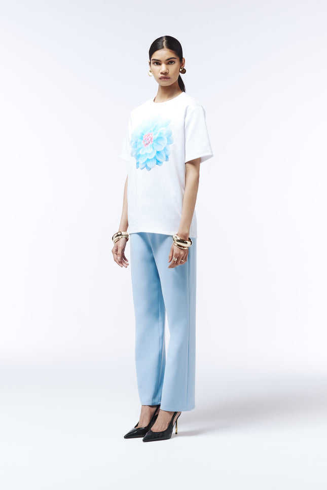 Soft blue cotton tee featuring oversized pastel dahlia graphic