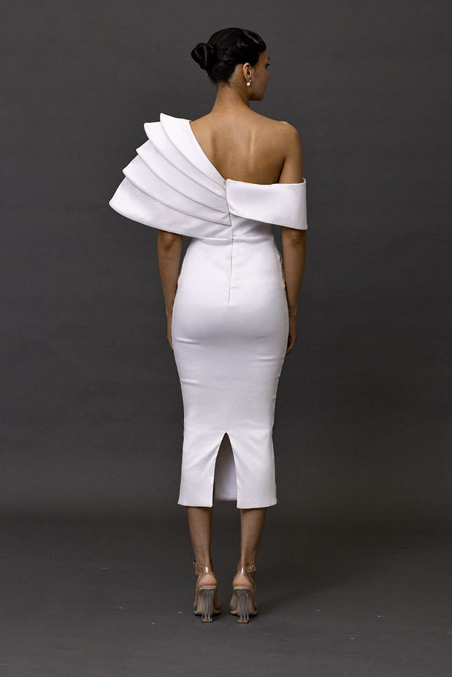 White one-shoulder dress with ruffled detailing on a dark background