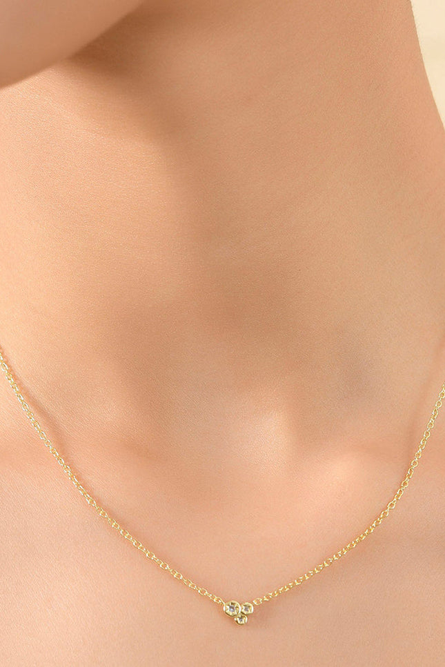 Close Shot Of Model Wearing Constellation Astrid Necklace By Arvino. Best CZ stone Gold plated Necklace.