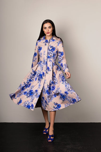 Cornflower Blue coat details – snap button front, hidden side pockets, and soft lining.