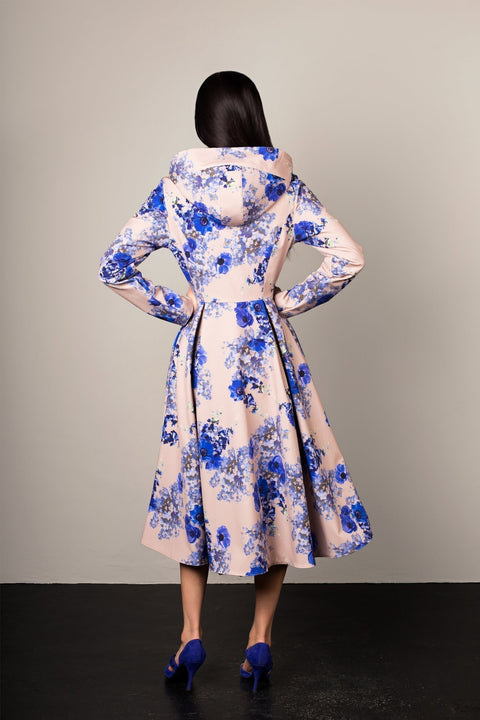 Back view of beige Cornflower Blue coat – soft blue flower pattern and pleated skirt detail.