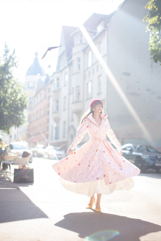 flared pink coat with flower print and polka dots